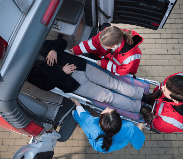 Image of an injured person taken care of medical personnel