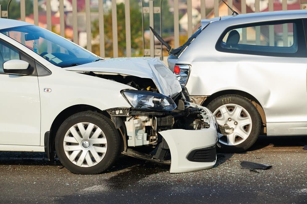 Rear end collision on both silver cars along the highway