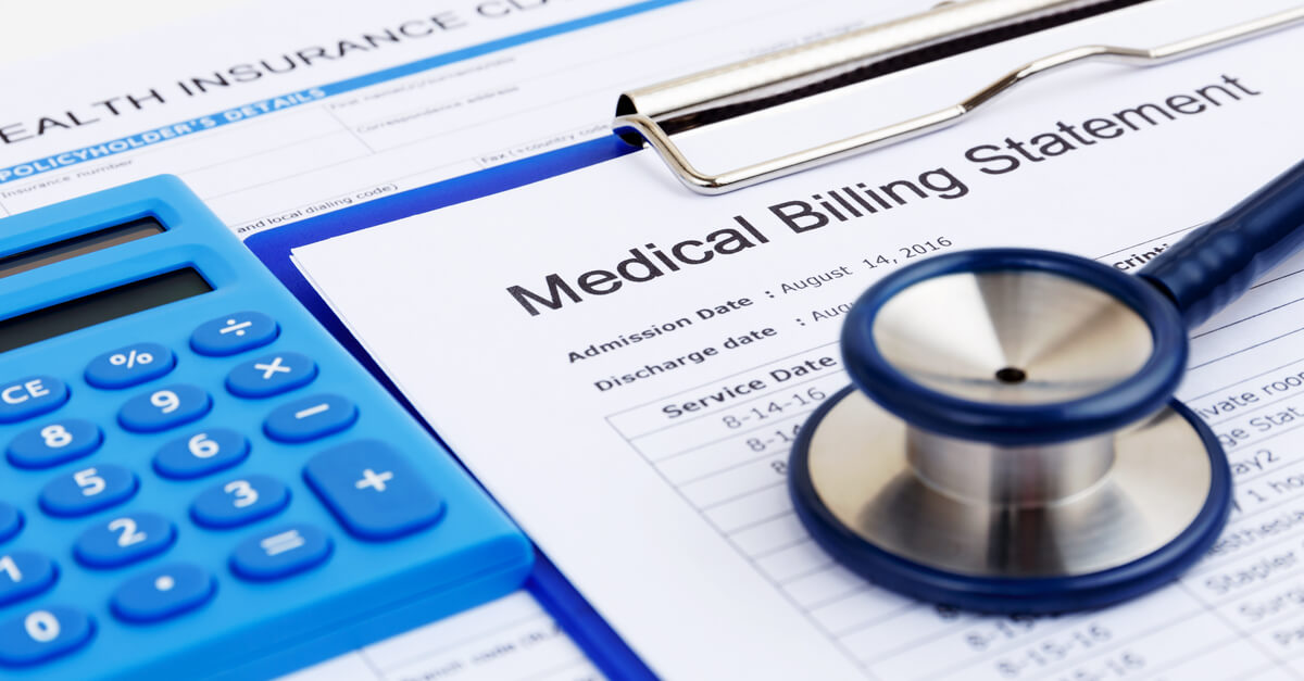 Stethoscope on top of medical billing statement
