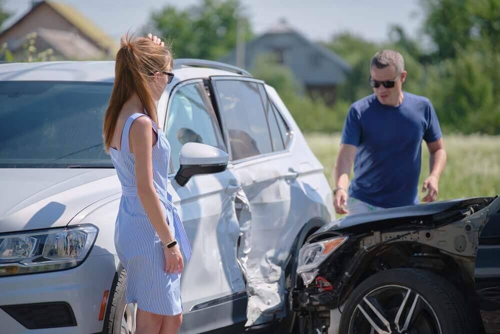 T-bone collision happening along the road.