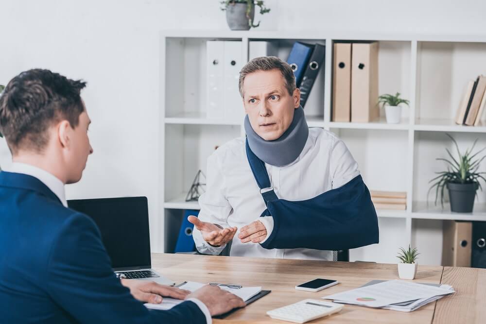 Injured worker submitting his work injury work claim form.