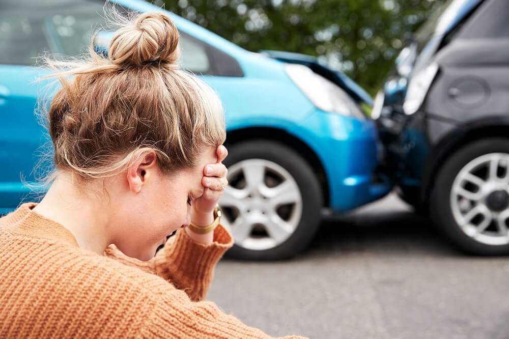Woman driver feeling worried on the car accident.