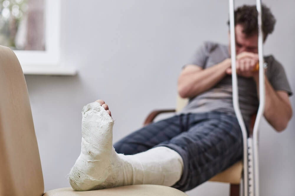 Man suffering leg injury from an accident.