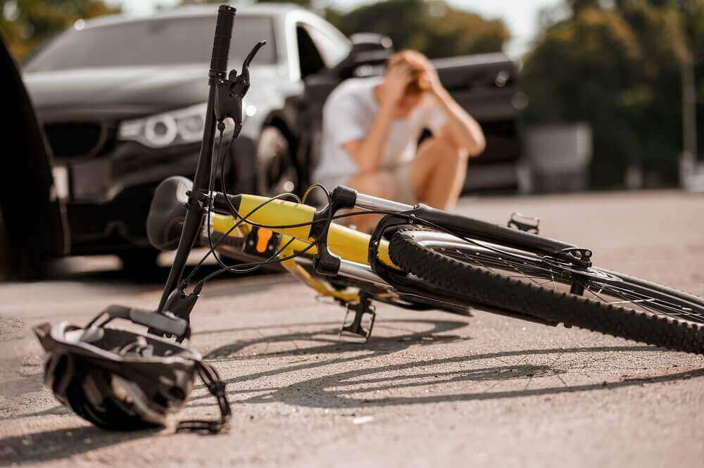 Car vs bicycle accident at the road.
