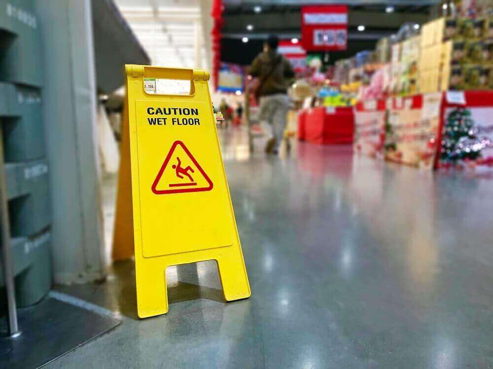 Caution warning sign for slip and fall on wet area.
