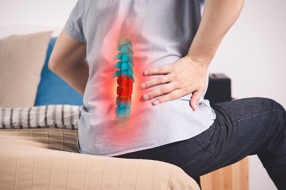Man suffering painful spinal injury from car accident.