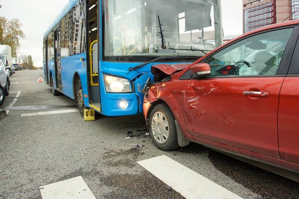 Bus accident happening along the highway.
