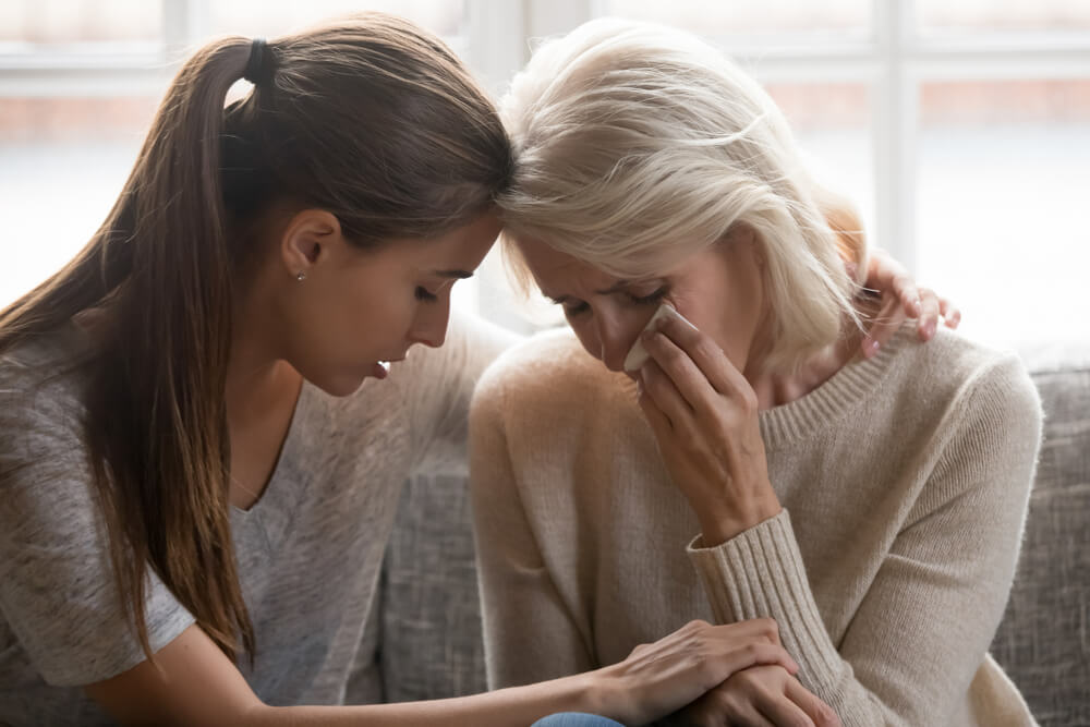Mother grieving over the loss of her late husband due to wrongful death.