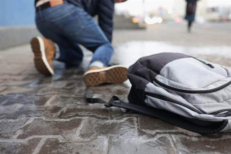 Pedestrian slip and fall from slippery sidewalk.
